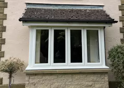 A square bay window section with a roof